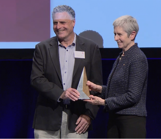 Prof Andrew Forbes receives Excellence in Trial Statistics award from Anne Kelso, NHMRC CEO