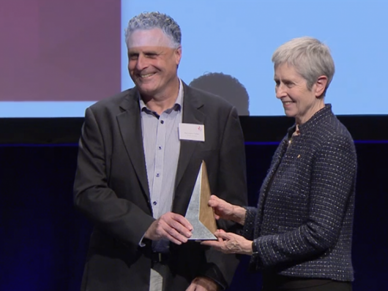 Prof Andrew Forbes receives Excellence in Trial Statistics award from Anne Kelso, NHMRC CEO